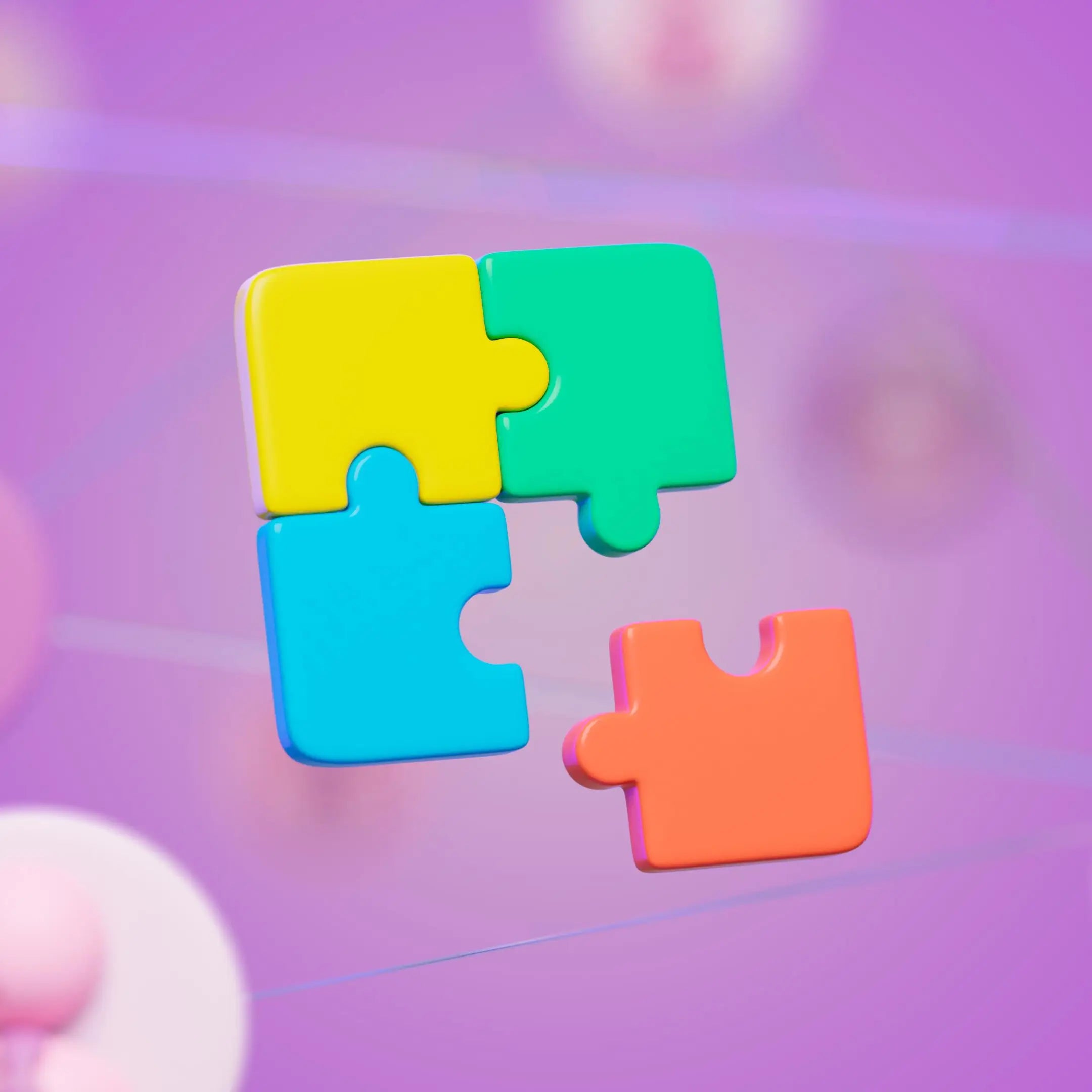 Four colorful puzzle pieces on a blurred background